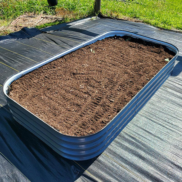 metal raised bed filled with soil